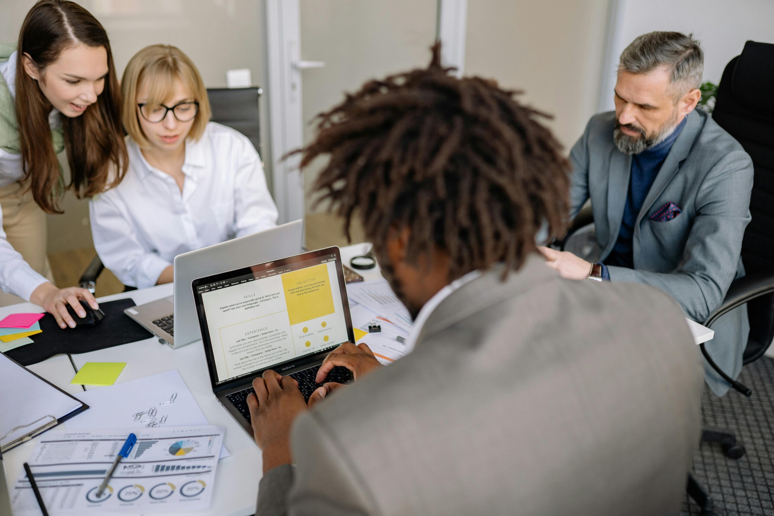 The sales and marketing team at Royal Executives working in the office